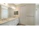 Modern bathroom with double vanity, quartz countertop, and tiled shower at 18265 Vizcaya Ct, Venice, FL 34293