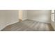 Bright bedroom with neutral walls, carpeting, and an adjacent bathroom at 18265 Vizcaya Ct, Venice, FL 34293