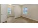 Bedroom with tile floors, window with blinds, and access to another room at 18265 Vizcaya Ct, Venice, FL 34293