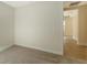 Simple bedroom with carpet flooring and access to another room at 18265 Vizcaya Ct, Venice, FL 34293