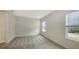 Spacious bedroom with neutral colored walls and carpeting at 18265 Vizcaya Ct, Venice, FL 34293