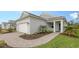 One-story home showcasing a white garage door and well-maintained landscaping at 18265 Vizcaya Ct, Venice, FL 34293