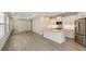 Modern kitchen with white cabinets, stainless steel appliances, and a large island at 18265 Vizcaya Ct, Venice, FL 34293
