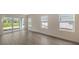 Bright living room with sliding glass doors and tile floors at 18265 Vizcaya Ct, Venice, FL 34293