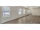 Spacious living area with neutral walls, tile floors, and large windows at 18265 Vizcaya Ct, Venice, FL 34293