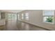 Open living space with tile floors and sliding glass doors to backyard at 18265 Vizcaya Ct, Venice, FL 34293