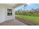 Covered patio with brick pavers and a view of the backyard at 18265 Vizcaya Ct, Venice, FL 34293