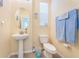 Clean bathroom with pedestal sink and updated fixtures at 7001 Interbay Blvd # 336, Tampa, FL 33616
