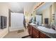 Bathroom with shower tub combo, double vanity, and granite countertop at 7001 Interbay Blvd # 336, Tampa, FL 33616