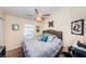 Bright bedroom with a queen-size bed and ceiling fan at 7001 Interbay Blvd # 336, Tampa, FL 33616