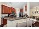 Kitchen with island, granite countertops, and hardwood floors at 7001 Interbay Blvd # 336, Tampa, FL 33616