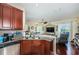 Kitchen with double sink, granite countertops, and hardwood floors at 7001 Interbay Blvd # 336, Tampa, FL 33616