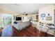 Open living room with hardwood floors and access to a patio at 7001 Interbay Blvd # 336, Tampa, FL 33616