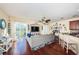 Open living room with hardwood floors, view into kitchen at 7001 Interbay Blvd # 336, Tampa, FL 33616