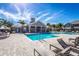 Community pool with lounge chairs and surrounding patio at 7001 Interbay Blvd # 336, Tampa, FL 33616