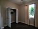 Bedroom with hardwood floors, window, and a closet at 9330 Hampshire Park Dr, Tampa, FL 33647