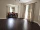 Bright dining room with hardwood floors and a view to the kitchen at 9330 Hampshire Park Dr, Tampa, FL 33647