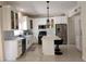 Modern kitchen with white cabinets, stainless steel appliances, and an island at 9330 Hampshire Park Dr, Tampa, FL 33647