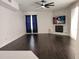 Spacious living room featuring a fireplace and dark hardwood floors at 9330 Hampshire Park Dr, Tampa, FL 33647