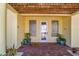 Elegant entryway with glass block windows and brick flooring at 505 S Bay Blvd, Anna Maria, FL 34216