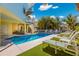 Inviting pool area with lounge chairs and lush landscaping at 505 S Bay Blvd, Anna Maria, FL 34216