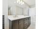 Bathroom with double vanity and dark brown cabinets at 1937 W Arch St, Tampa, FL 33607