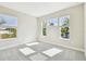 Bright bedroom with carpet flooring and multiple windows at 1937 W Arch St, Tampa, FL 33607