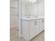Double vanity with white cabinets and quartz countertops at 1939 W Arch St, Tampa, FL 33607