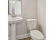 Simple powder room with white toilet and sink at 1939 W Arch St, Tampa, FL 33607