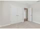 Bright bedroom with double doors leading to another room at 1939 W Arch St, Tampa, FL 33607