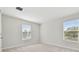Well-lit bedroom featuring neutral walls and carpet flooring at 1939 W Arch St, Tampa, FL 33607