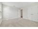 Spacious bedroom with neutral carpeting and double doors at 1939 W Arch St, Tampa, FL 33607