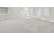 Bright bedroom with neutral carpeting and large windows at 1939 W Arch St, Tampa, FL 33607