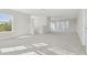 Bright and airy bonus room with neutral carpet and multiple windows at 1939 W Arch St, Tampa, FL 33607