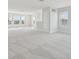 Large bonus room featuring neutral carpeting and plenty of natural light at 1939 W Arch St, Tampa, FL 33607