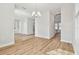 Open concept dining room with hardwood floors and chandelier at 1939 W Arch St, Tampa, FL 33607