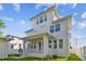 Two-story house with a covered porch, and landscaped yard at 1939 W Arch St, Tampa, FL 33607