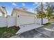 White garage with a new concrete driveway at 1939 W Arch St, Tampa, FL 33607