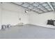 Bright garage interior with epoxy floor and storage at 1939 W Arch St, Tampa, FL 33607