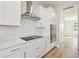 Modern kitchen with stainless steel appliances and white cabinets at 1939 W Arch St, Tampa, FL 33607
