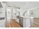 Modern kitchen with stainless steel appliances and white cabinets at 1939 W Arch St, Tampa, FL 33607