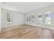 Bright living room featuring hardwood floors and French doors at 1939 W Arch St, Tampa, FL 33607