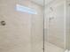 Large walk-in shower with neutral tile and glass enclosure at 1939 W Arch St, Tampa, FL 33607