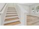 Modern staircase with light wood treads and white risers at 1939 W Arch St, Tampa, FL 33607