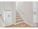 Modern staircase with light wood steps and white risers at 1939 W Arch St, Tampa, FL 33607