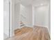 Upstairs hallway with hardwood floors and access to bedrooms at 1939 W Arch St, Tampa, FL 33607