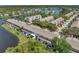 Aerial view of townhouses situated on a tranquil lake at 528 Black Lion Ne Dr, St Petersburg, FL 33716