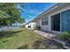 Back patio with lake view, sliding glass doors, and a spacious layout at 528 Black Lion Ne Dr, St Petersburg, FL 33716