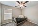 Small bedroom with a twin-size bed and ceiling fan at 288 Rain Berry Ave, Ruskin, FL 33570