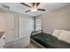 Bedroom with twin bed, ceiling fan and double door closet at 288 Rain Berry Ave, Ruskin, FL 33570